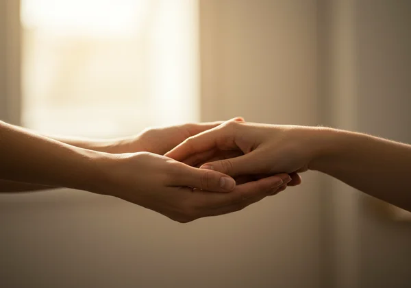 Hands reaching out to provide support and help.